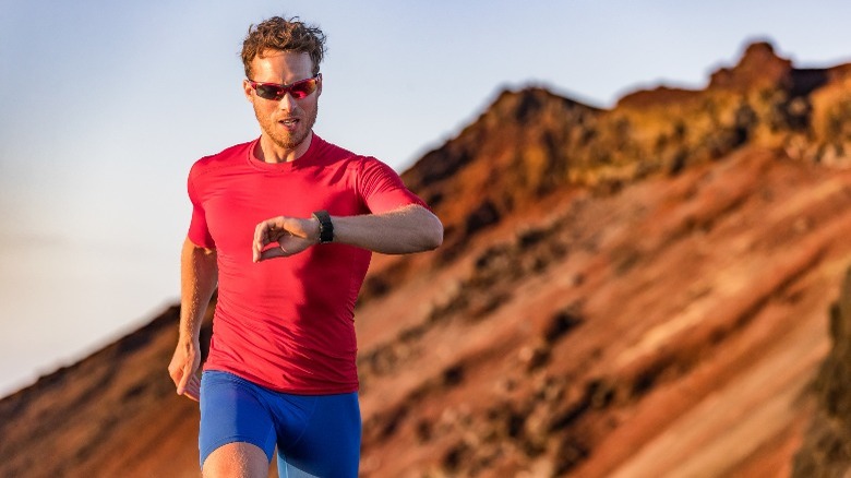 man jogging with wristwatch 
