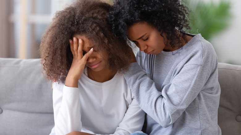 mom consoling daughter