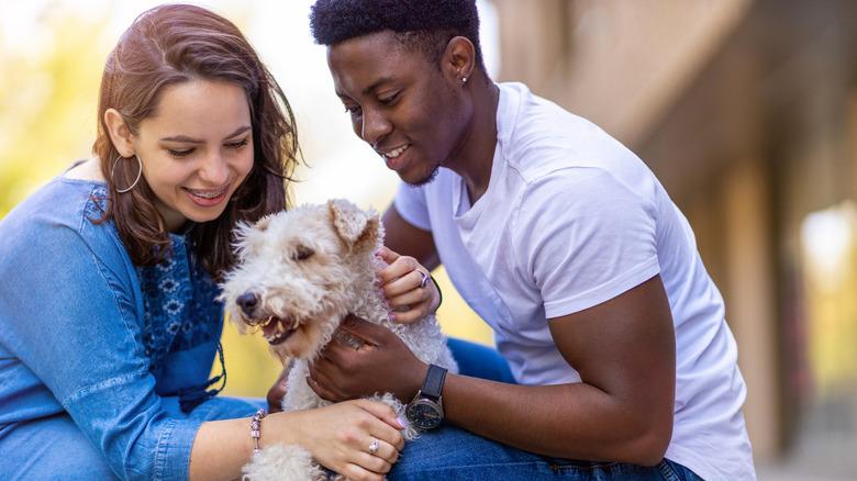 Man and woman with dog
