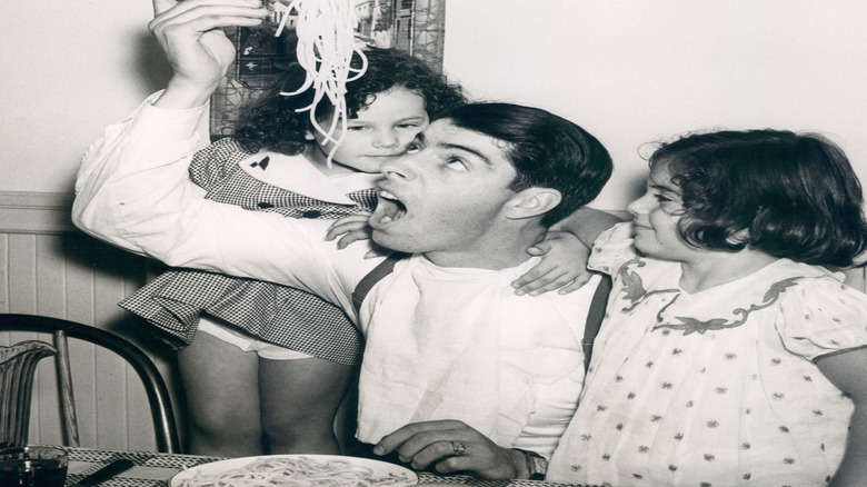 Joe DiMaggio eating pasta