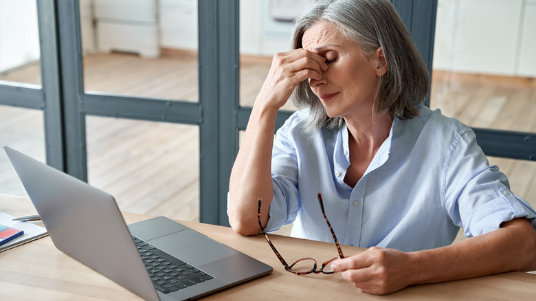 woman tired at computer