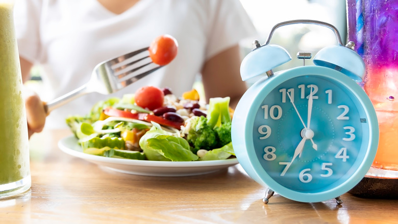 intermittent fasting concept with clock