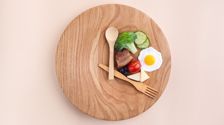 Food on wooden clock