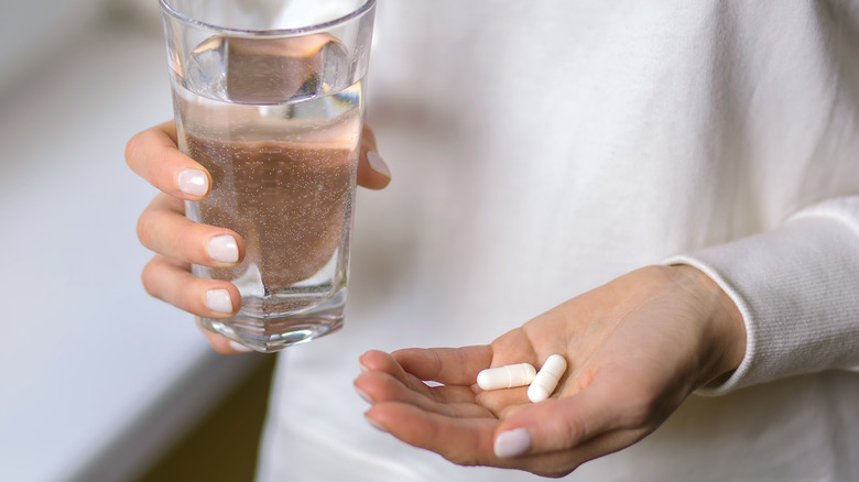 Woman taking antibiotics for chlamydia 