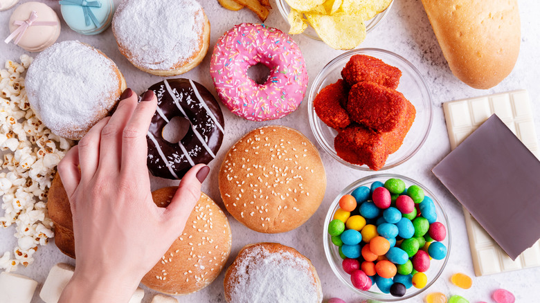 person grabbing donut