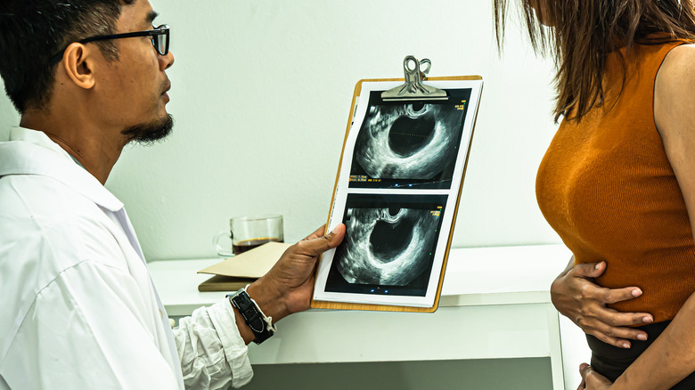 A doctor and patient speaking about a cyst