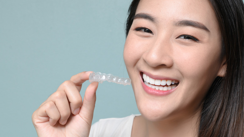 woman holding retainer