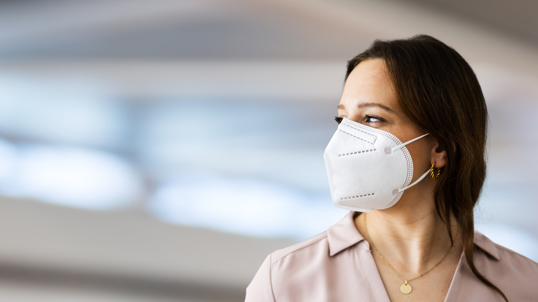 Close-up of woman wearing N95 medical face mask.