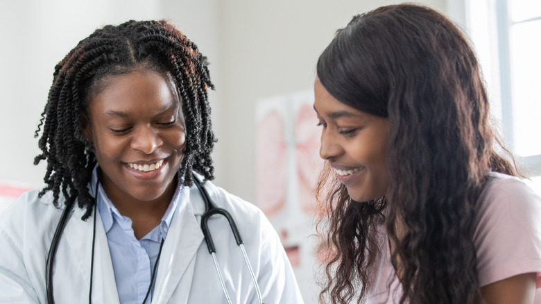 woman speaking with her gynecologist