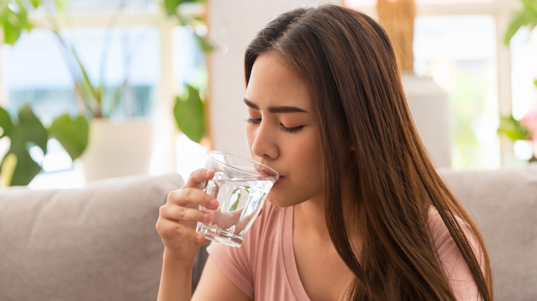 woman taking medication