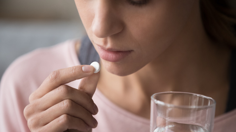 woman taking medication