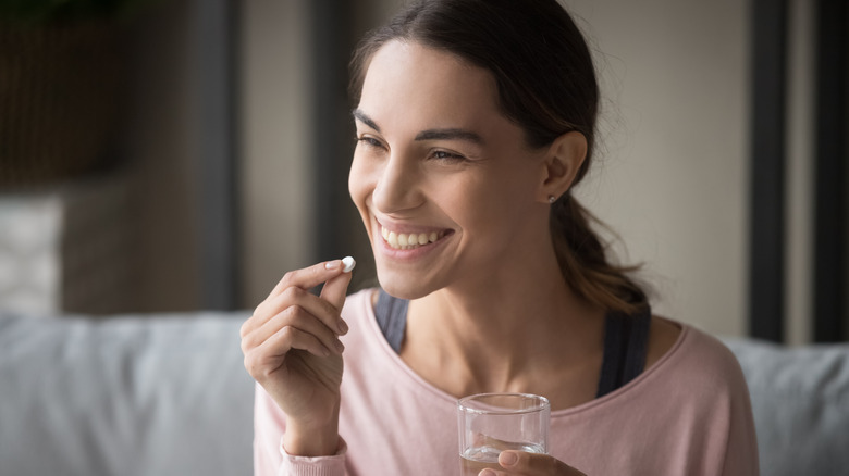 woman taking medication