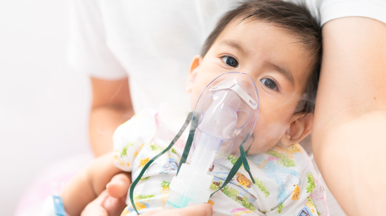 Baby with vapor nebulizer