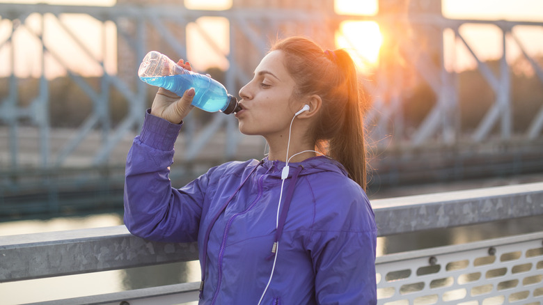 woman drinking energy drink