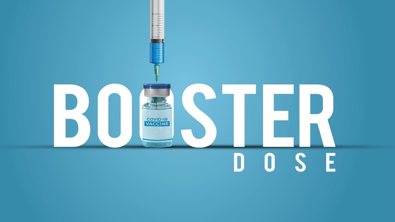 Booster dose COVID-19 text with vial and needle.