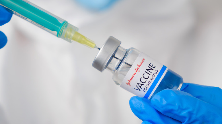 Needle and vial of COVID-19 vaccine 