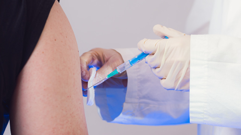 Person getting COVID-19 shot