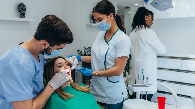 dentish with client at the surgery