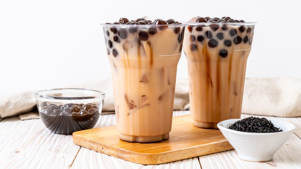two bubble teas with an all white background 
