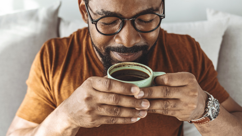 man enjoying cup of coffee