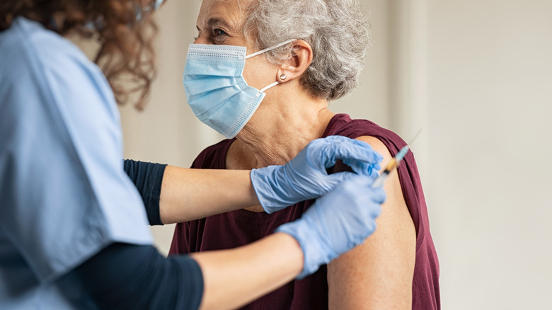 Older woman getting vaccine