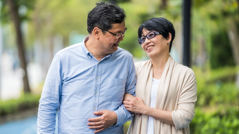 Romantic couple walking in park