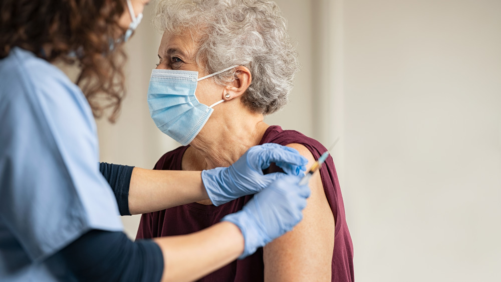 person getting covid-19 vaccine