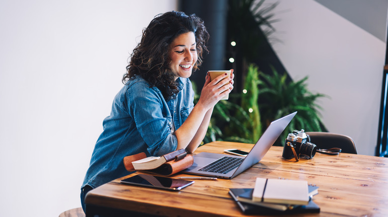 A woman drinks coffee in the morning