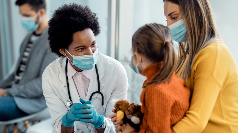 Mother and child with doctor