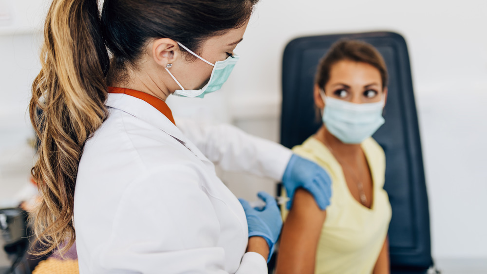 woman getting vaccinated