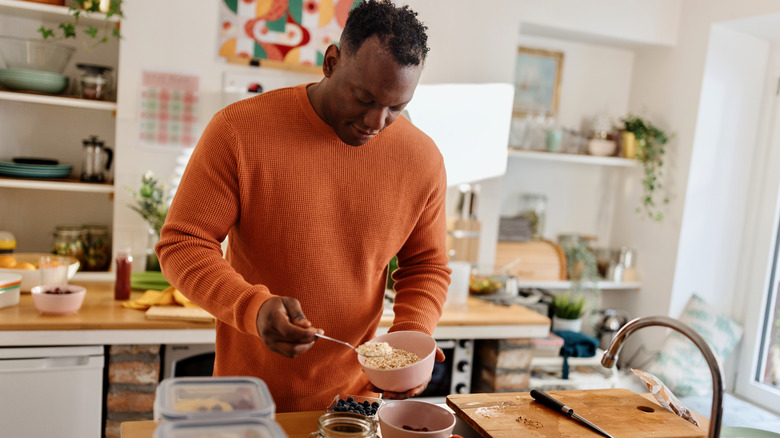 man doing meal prep for a high protein diet