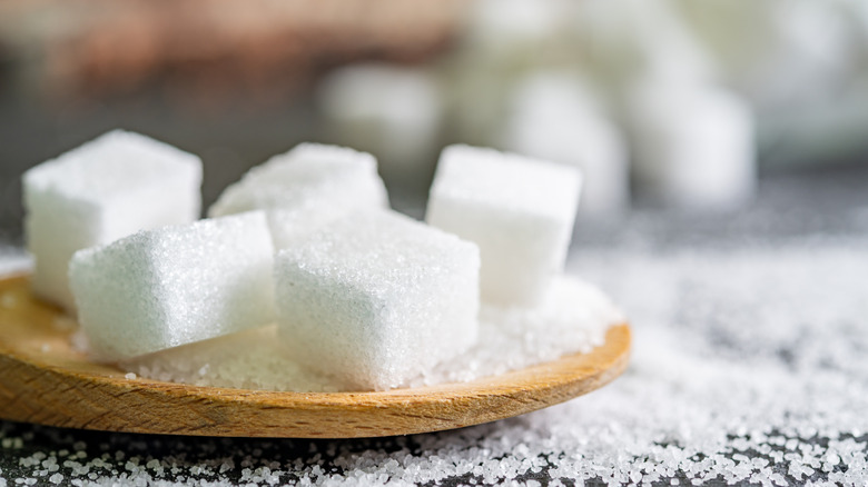 Cubes of sugar on a spoon