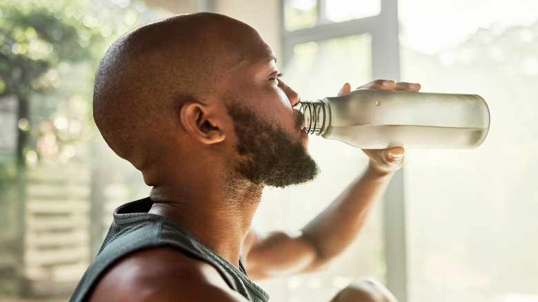 Man drinking water bottle