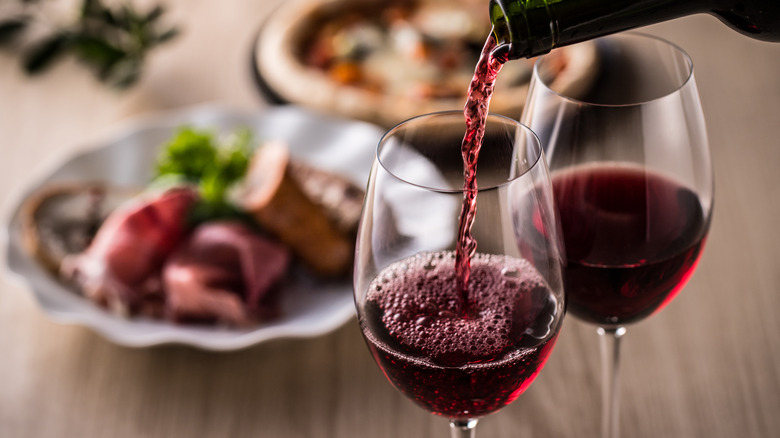 Pouring two glasses of wine