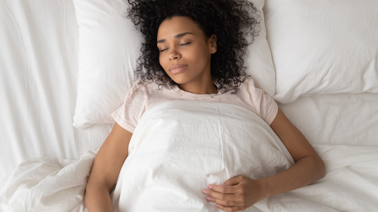 Woman sleeping on back