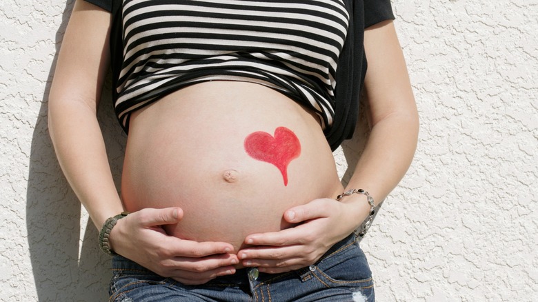 pregnant belly with a heart