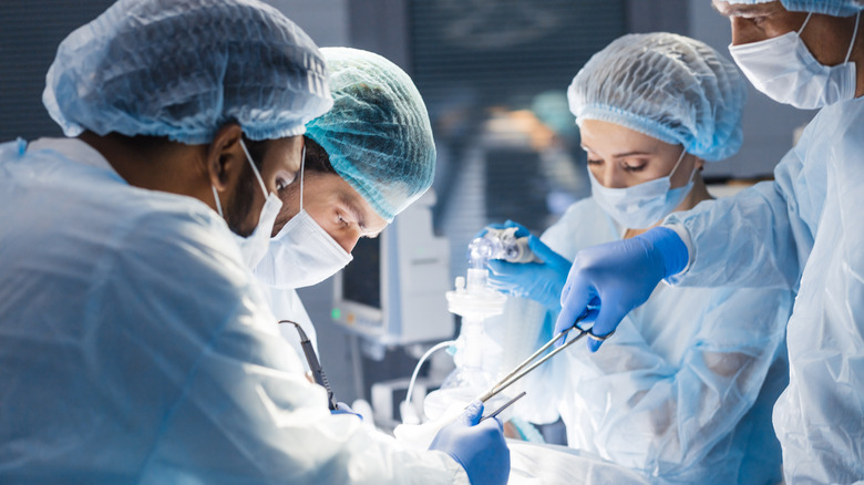 Surgical team performing surgery