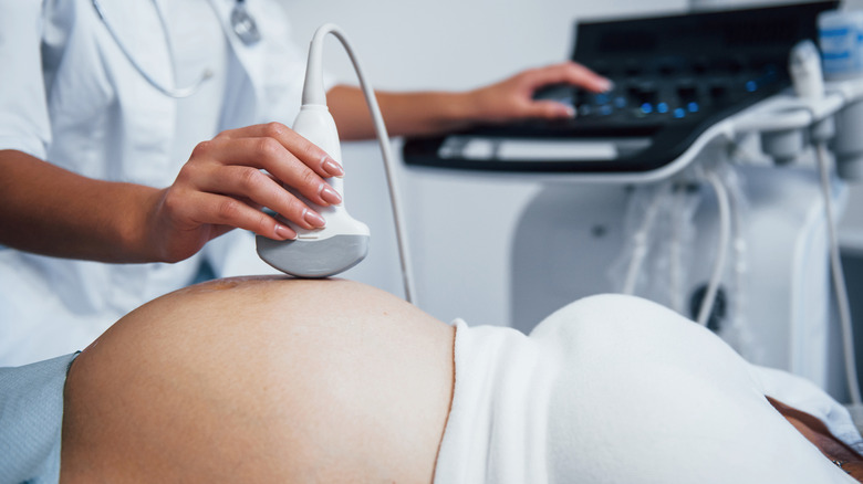 pregnant woman receiving ultrasound