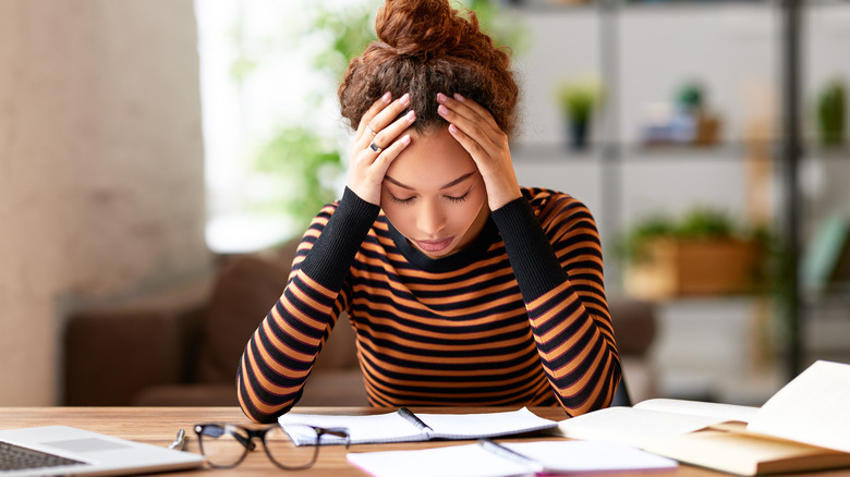 Stressed teen girl at desk
