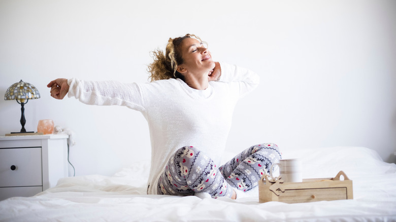 woman sitting on bed