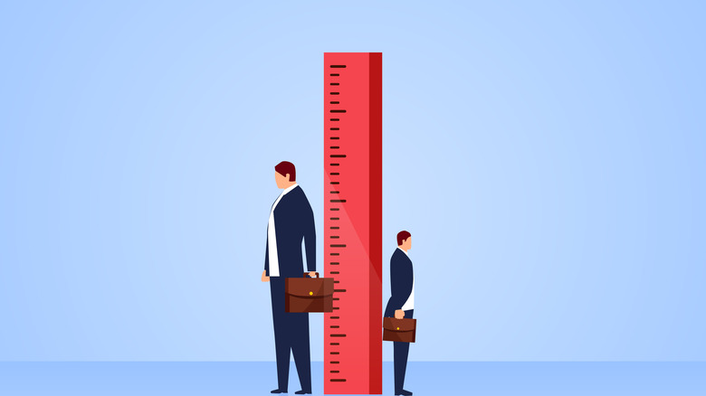 tall and short men with ruler drawing
