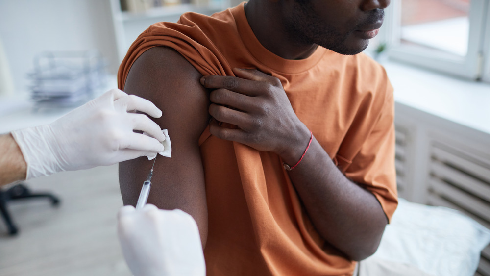 Man getting COVID-19 vaccine