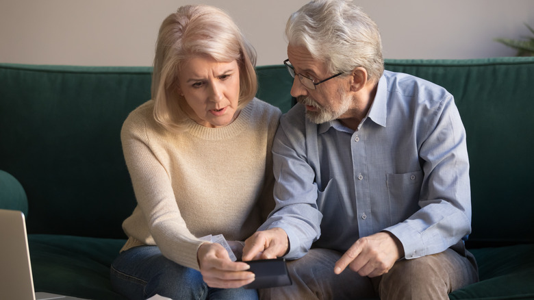stressed senior couple talking