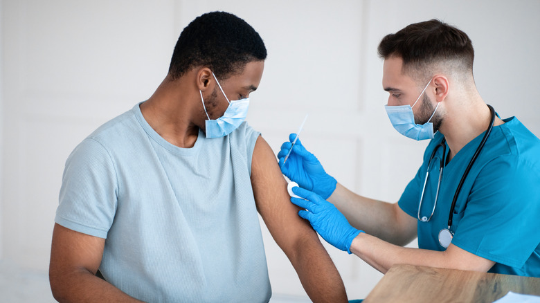 A man gets a vaccine