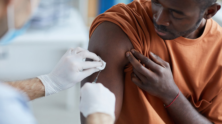 Man receiving vaccine shot