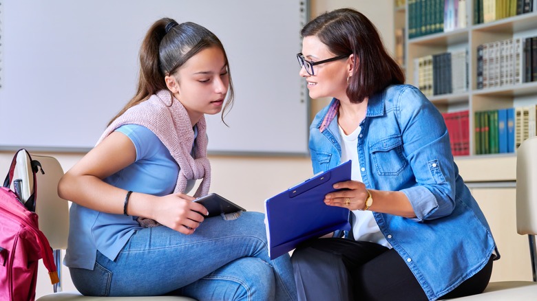 Teen talking with doctor on couch