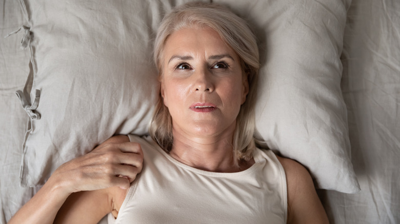 woman having trouble falling asleep