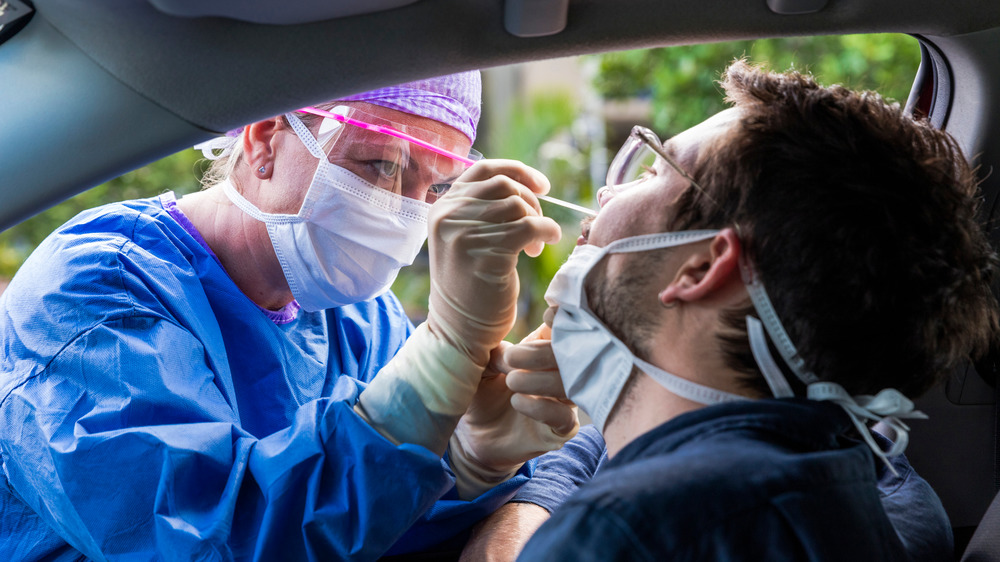 Medical worker conducting COVID-19 test