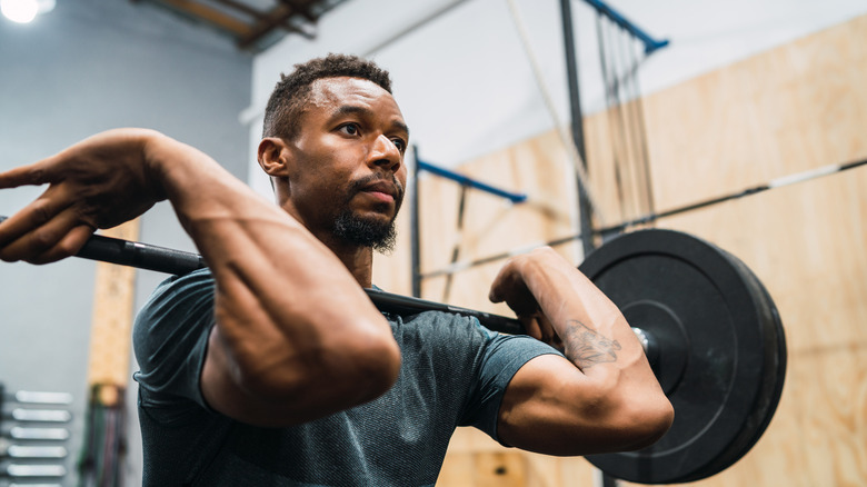 Man doing CrossFit with barbell