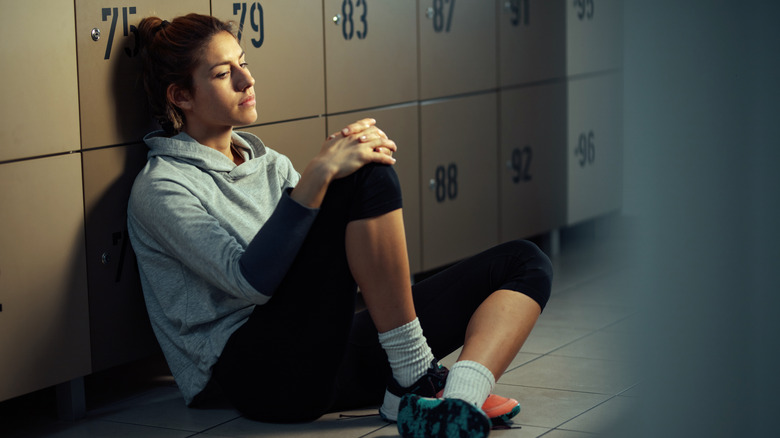 Athletic woman feeling depressed
